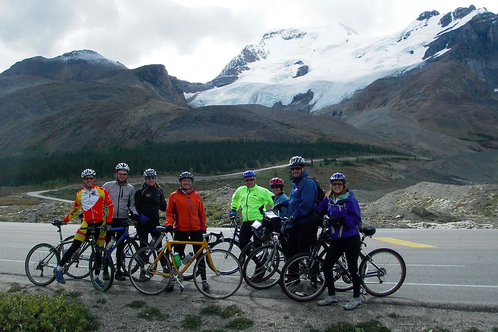Cyclists spaced along a gentle climb